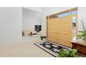 Bright foyer with tile flooring, double doors, and a view into the adjacent living room at 2713 Slate Ct, Superior, CO 80027