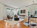 Bright living area with hardwood floors, large windows, and stylish furnishings at 2880 Emporia Ct, Denver, CO 80238