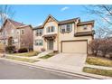Charming two-story home with a two-car garage, neutral color palette, and well-maintained front lawn at 3815 Red Deer Trl, Broomfield, CO 80020