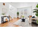 Bright living room features hardwood floors, neutral decor, and plenty of natural light at 3815 Red Deer Trl, Broomfield, CO 80020
