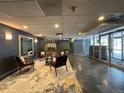 The building's lobby features lounge furniture and a view of the building's entrance at 888 N Logan St # 2C, Denver, CO 80203
