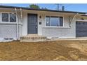 Charming single-story home with a brick facade and well-maintained front door at 8097 E Lehigh Dr, Denver, CO 80237