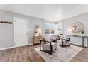 Bright living room with hardwood floors and comfy armchairs at 1157 Krameria St, Denver, CO 80220