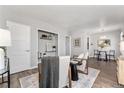 Living area with hardwood floors and a dining area at 1157 Krameria St, Denver, CO 80220