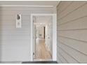 A bright entryway with light wood floors leading into the condo at 4896 S Dudley St # 8, Littleton, CO 80123