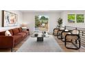 Bright living room featuring modern furnishings, a comfortable sofa, and a view of the outdoors at 1029 N Columbine St, Golden, CO 80403