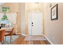 Inviting home foyer featuring beautiful wood flooring and a bright entry at 9756 Quay Loop, Broomfield, CO 80021