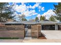 Attractive single-story home with modern curb appeal, featuring a fenced yard, private gate, and a spacious driveway at 3275 19Th St, Boulder, CO 80304