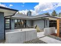 Backyard patio area showcasing concrete decor, gray brick, and a beautifully landscaped outdoor space at 3275 19Th St, Boulder, CO 80304