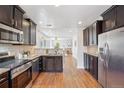 Modern kitchen featuring stainless steel appliances, granite countertops, and an open layout at 1552 Hudson St, Denver, CO 80220