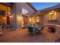 Charming outdoor patio area with comfortable seating and elegant lighting at 11541 Warrington Ct, Parker, CO 80138