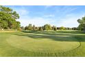 Scenic view of the golf course with lush green grass and mature trees at 3022 S Wheeling Way # 109, Aurora, CO 80014