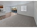 Open concept living room and kitchen with hardwood floors at 25643 E Bayaud Ave, Aurora, CO 80018