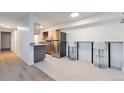 Eat-in kitchen featuring stainless steel refrigerator and granite countertops at 7335 E Quincy Ave # 104, Denver, CO 80237