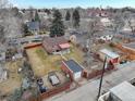 Aerial view showing the neighborhood, fenced yard, and nearby street at 4850 E 18Th Ave, Denver, CO 80220