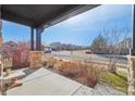 Inviting front porch featuring brick columns and providing a pleasant outdoor seating area at 25123 E 5Th Ave, Aurora, CO 80018