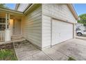 Corner view of a two-story home with attached garage and covered front entrance at 21767 Silver Meadow Ln, Parker, CO 80138