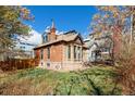 View of backyard and exterior showing chimney, brickwork and architecture at 3147 Umatilla St, Denver, CO 80211