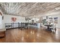 Bright open-concept space featuring a modern kitchen, and refinished hardwood floors at 11542 W 67Th Way, Arvada, CO 80004