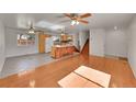 Spacious living area with hardwood floors and seamless access to the kitchen at 15017 E Greenwood Pl, Aurora, CO 80014