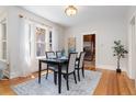 Cozy dining room featuring modern decor, wood floors and ample natural light at 1121 S Ogden St, Denver, CO 80210