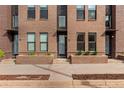Attractive brick townhomes with landscaped front entrances offer a modern urban living experience at 2436 Welton St, Denver, CO 80205