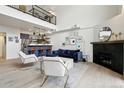 Open living area with high ceilings, fireplace, and modern furniture at 4520 Broadway St # 208, Boulder, CO 80304