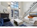 Spacious living room with floor to ceiling windows and fireplace at 4520 Broadway St # 208, Boulder, CO 80304