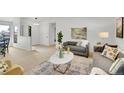 Inviting living room showcasing stylish decor, comfortable sofas, and ample natural light at 11267 W Colorado Pl, Denver, CO 80232