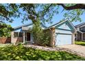 Light blue home featuring a well-manicured lawn and inviting front entrance at 3715 E 139Th Pl, Thornton, CO 80602