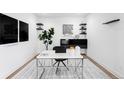Modern office space with sleek desk, stylish shelving, and minimalist decor at 16262 W 95Th Ln, Arvada, CO 80007
