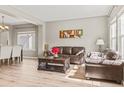 Living room with view of the dining area and hardwood floors at 15021 Josephine St, Thornton, CO 80602