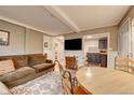Living room adjacent to kitchen, features a dining area and comfortable seating at 4642 Plettner Ln, Evergreen, CO 80439