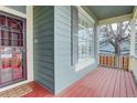 The house features a welcoming front porch, perfect for relaxing and enjoying the neighborhood at 16159 W 70Th Pl, Arvada, CO 80007