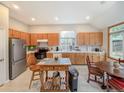Open kitchen featuring stainless steel refrigerator and lots of natural light at 9806 Hooker Ct, Westminster, CO 80031