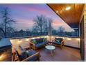 Cozy rooftop deck with comfortable seating, string lights, and scenic views at sunset at 3201 W 25Th Ave, Denver, CO 80211