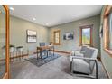 Bright and airy office space featuring warm wood trim, plush carpet, and serene decor at 1140 Indian Peak Rd, Golden, CO 80403