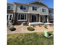 The home's backyard has a stone landscape and a well-maintained lawn at 14883 E Crestridge Dr, Centennial, CO 80015