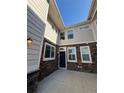 Home entrance with charming stone facade and a welcoming front door at 14883 E Crestridge Dr, Centennial, CO 80015