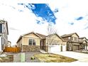 Attractive one-story home with stone accents, a two-car garage, and a xeriscaped front yard at 14758 Normande Dr, Mead, CO 80542