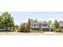 Suburban home near neighborhood park, with mature trees and a manicured front yard at 1140 Devonshire Ct, Lafayette, CO 80026