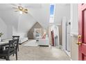 Inviting living room with a white sofa, dining table, vintage ceiling fan and a well lit view at 1136 N Logan St # 8, Denver, CO 80203