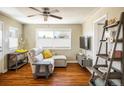 Cozy living room with hardwood floors, a sectional sofa, and natural light at 190 S Canosa Ct, Denver, CO 80219