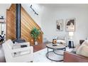 Bright living room with a wood burning stove and white upholstered furniture at 1595 Macarthur Dr, Boulder, CO 80303