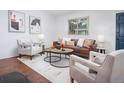 Inviting living area with contemporary art, a large window and comfortable furniture at 1595 Macarthur Dr, Boulder, CO 80303