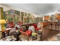 Bright living area with expansive windows showcasing scenic views, open to dining and kitchen at 609 Brook Dr, Idaho Springs, CO 80452