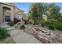 Detailed view of a rock water feature in the front yard landscaping at 9375 Webster Way, Westminster, CO 80021