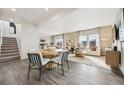 Bright living space with open floor plan, hardwood floors, and abundant natural light at 2153 Flower Blossom Ave, Brighton, CO 80601