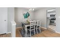 Bright dining area features a table and chairs with kitchen access at 6963 S Albion St, Centennial, CO 80122