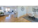 Bright and open living area featuring hardwood floors, a modern fireplace, and abundant natural light at 2425 Waneka Lake Trl, Lafayette, CO 80026